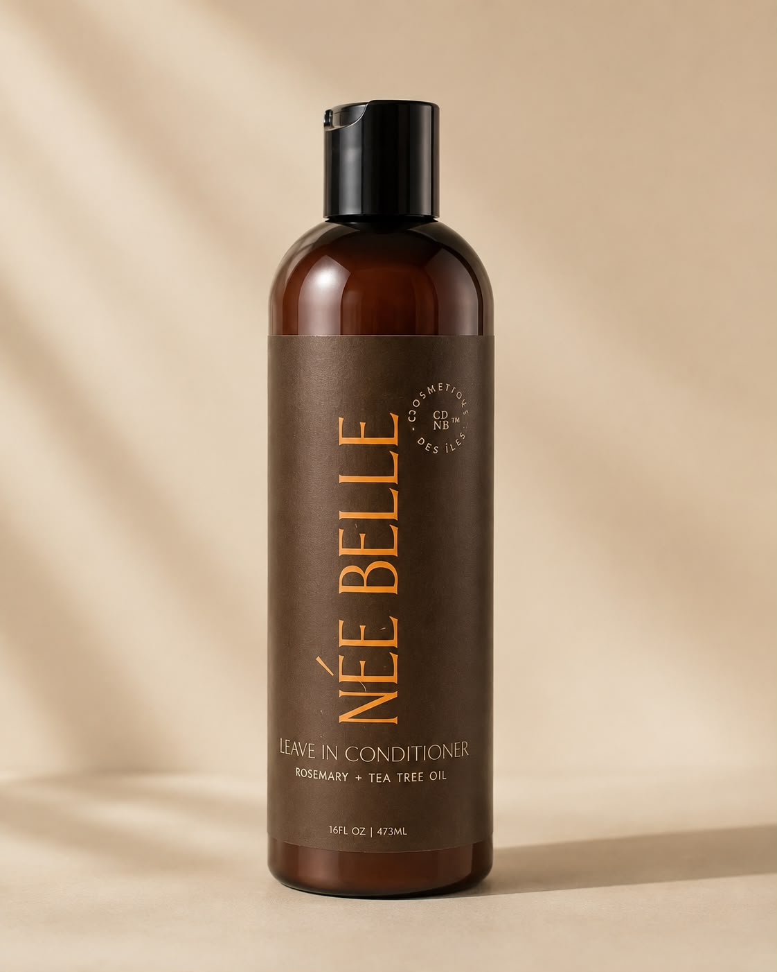 A bottle of Née Belle Leave-In Conditioner with Rosemary